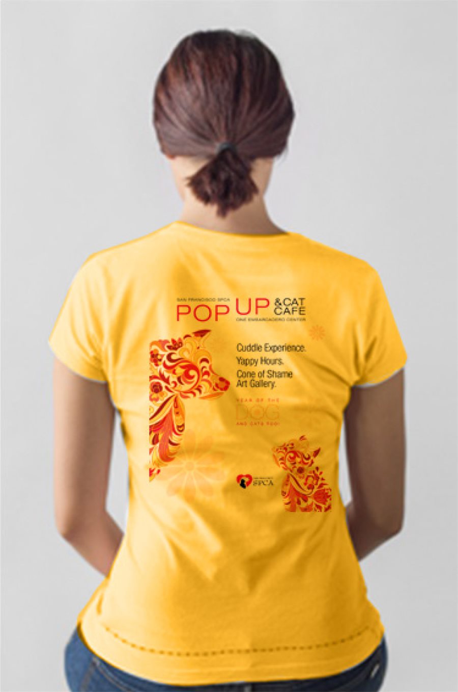 Volunteer wearing the Pop Up & Cat Cafe t-shirt